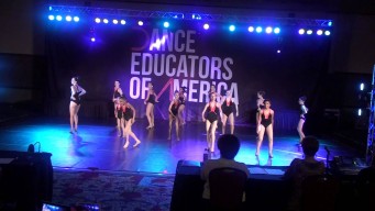 background photo of small children ballet dancing on a stage