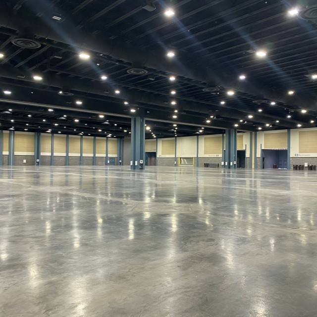 Empty Exhibit Hall AB with concrete floor