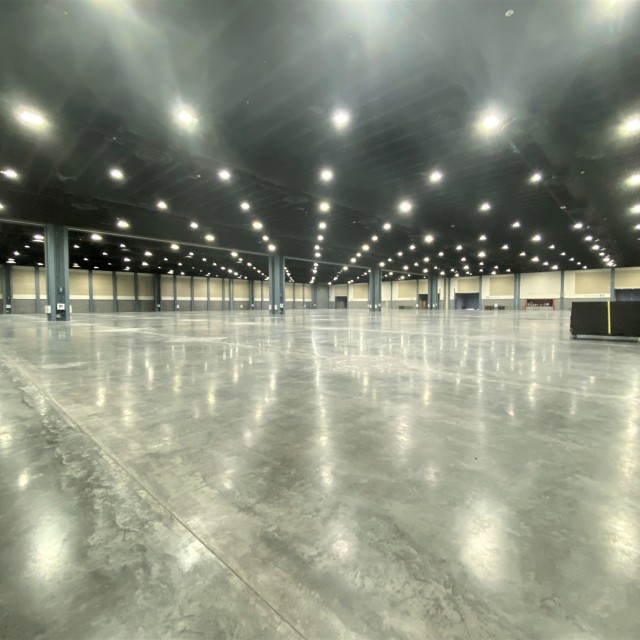 Empty Exhibit Hall AB with concrete floor